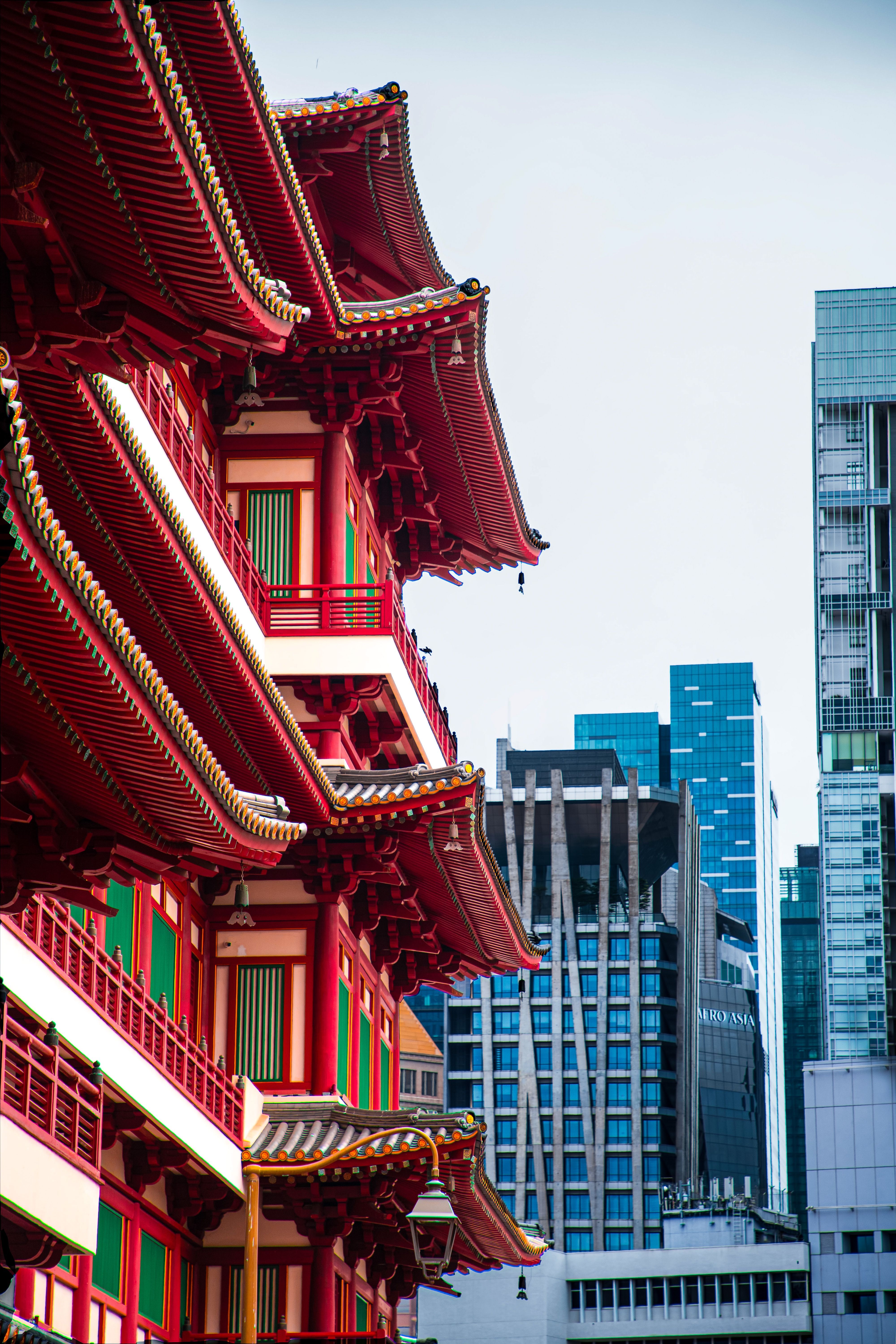 A temple in Singapore set against the city skyline